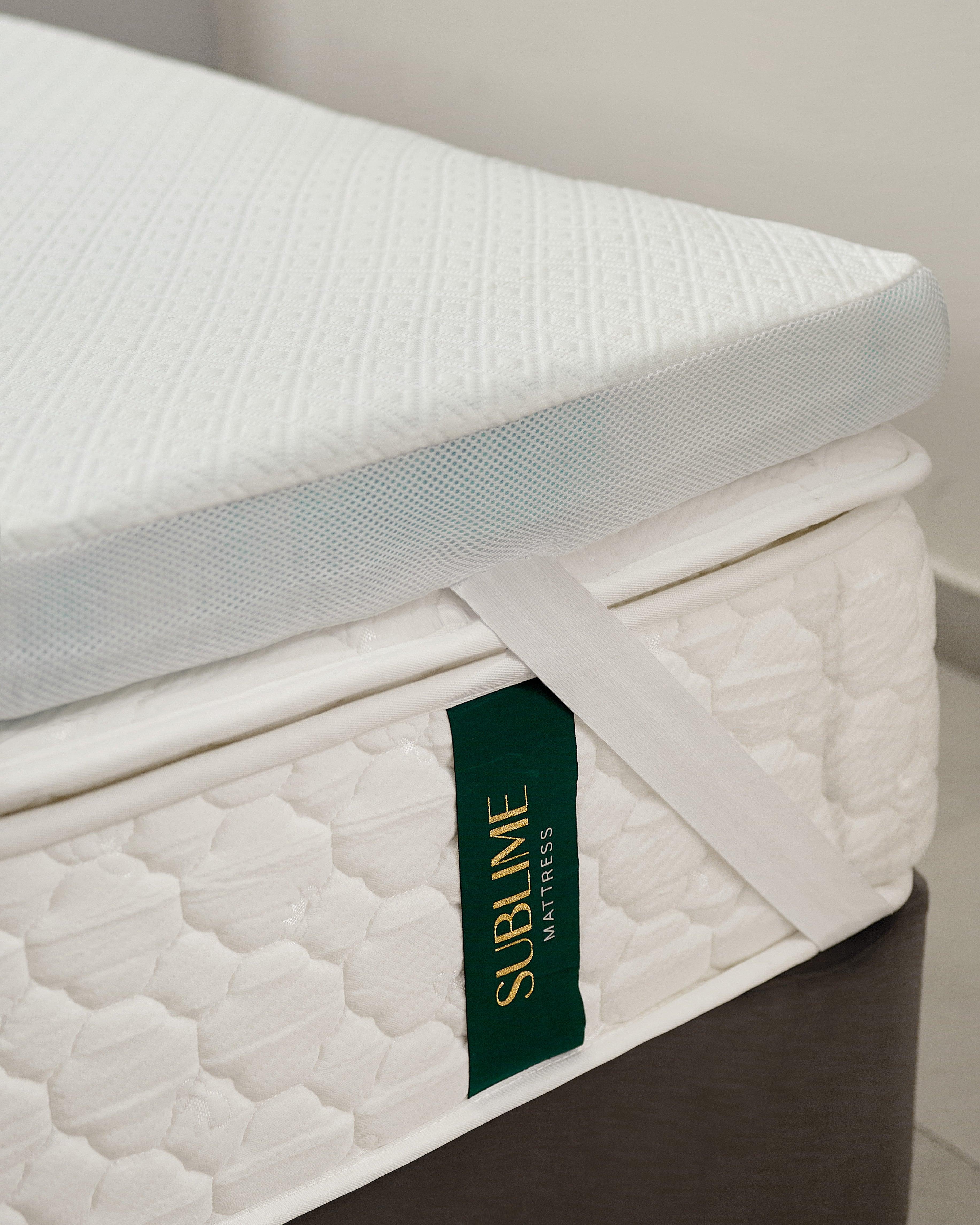 Gel memory foam mattress topper with removable cover on Sublime mattress for enhanced comfort and temperature regulation