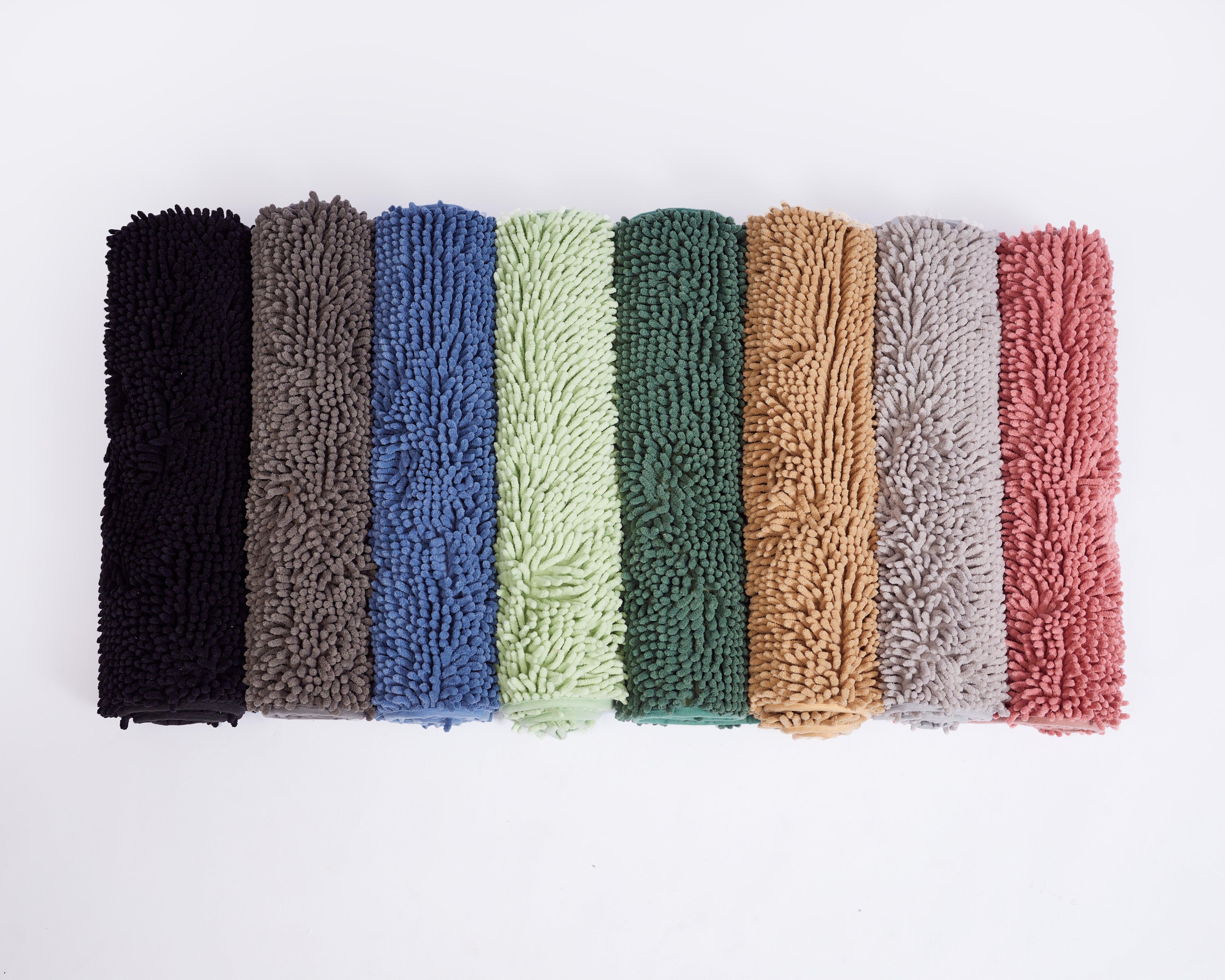 Soft and plush Mily Bath Rugs in various colors, featuring anti-spill and non-slip design for luxury bathroom comfort.