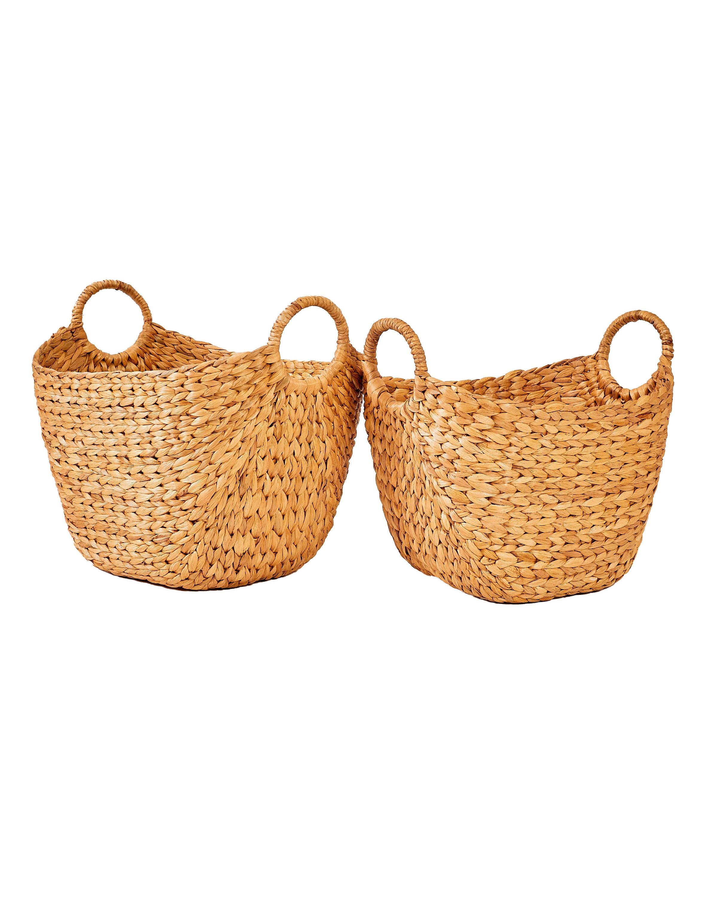 Two Rosa Water Hyacinth Baskets in medium and small sizes with round handles for storage and laundry organization
