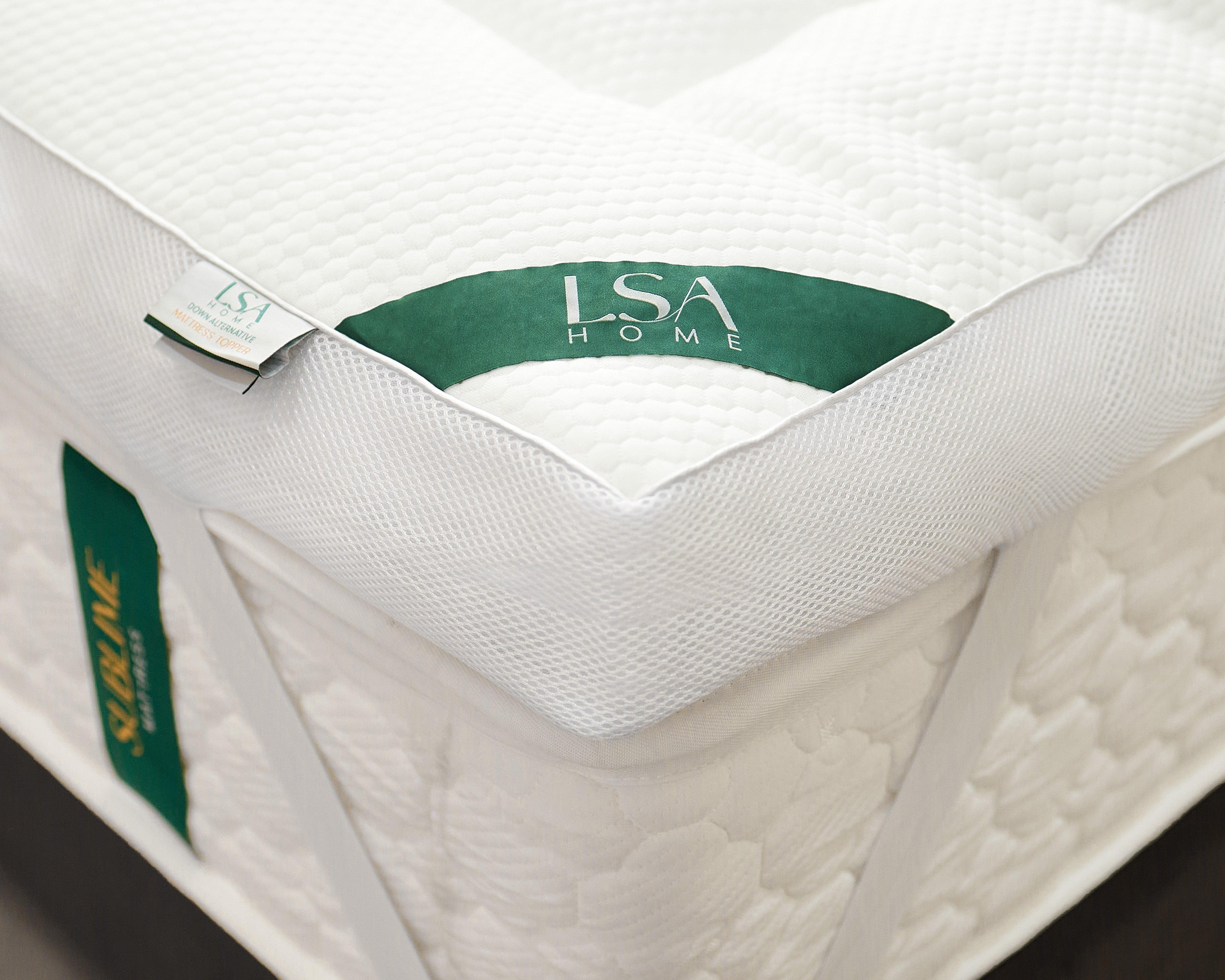 Down Alternative Mattress Topper with soft quilted surface and corner elastic straps for secure fit on mattress