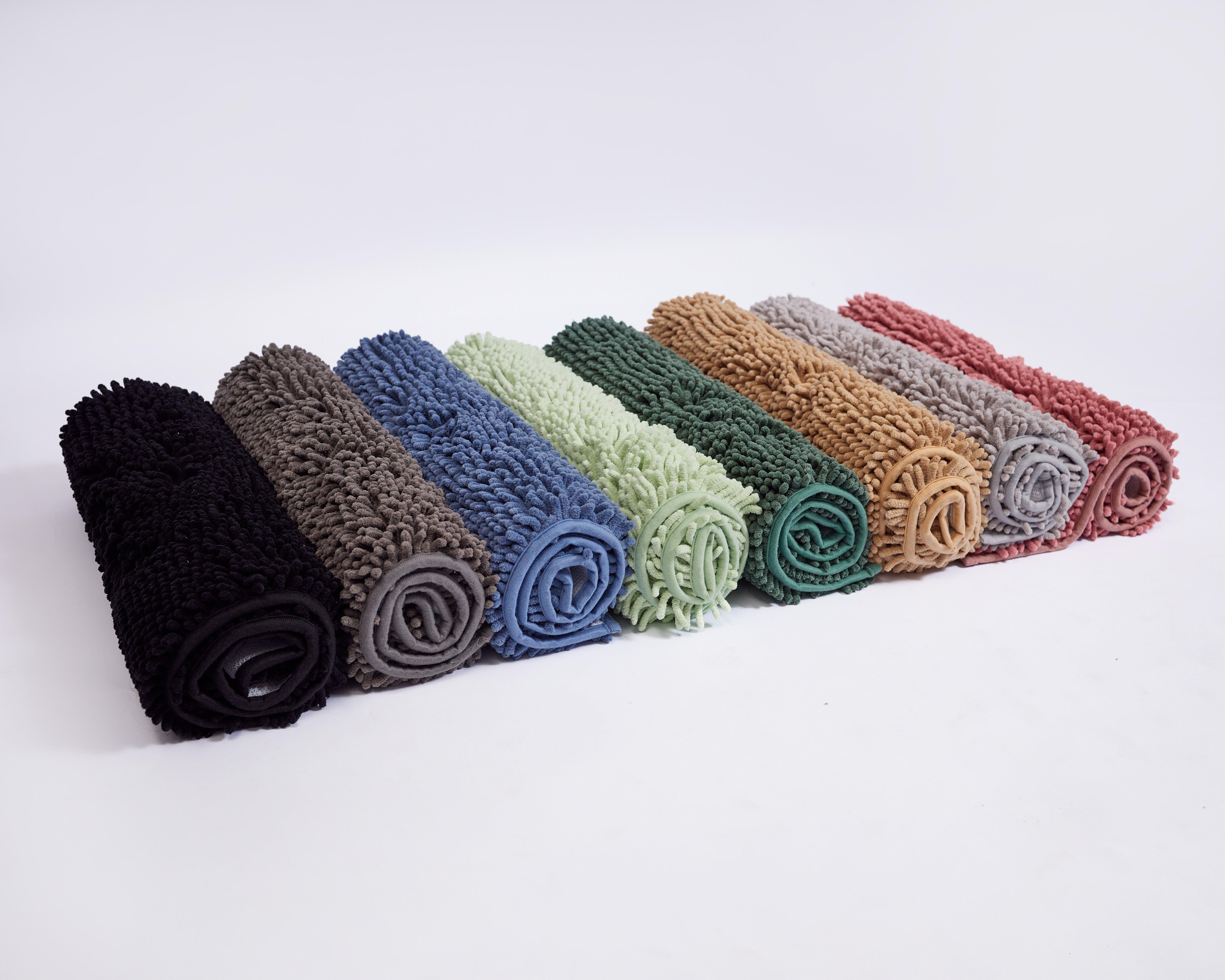 Rolled Mily Bath Rug in multiple colors showcasing soft, plush, anti-spill, and non-slip features for bathroom use