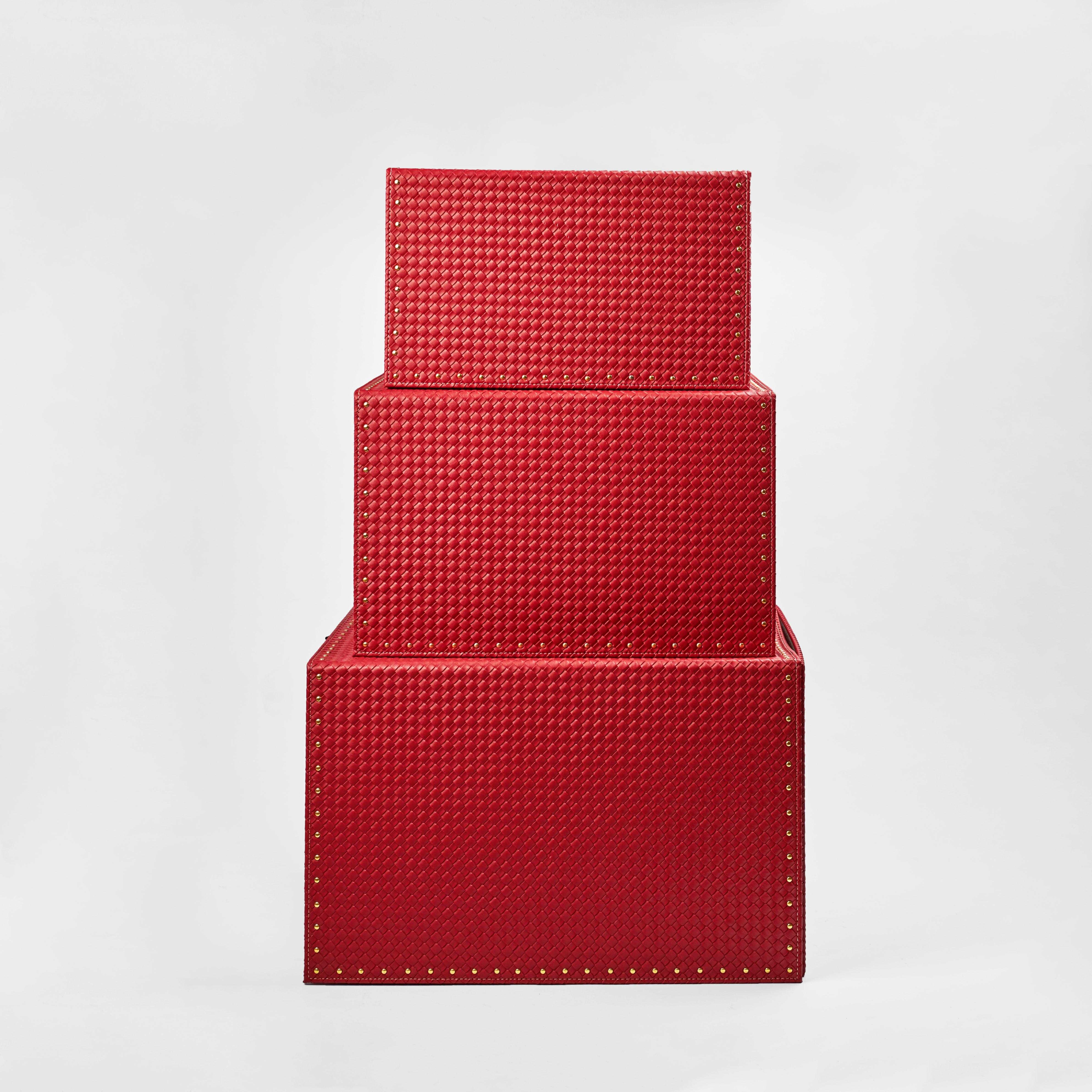 Luxus Boxes in red leather, three sizes stacked elegantly for gift-giving and storage.
