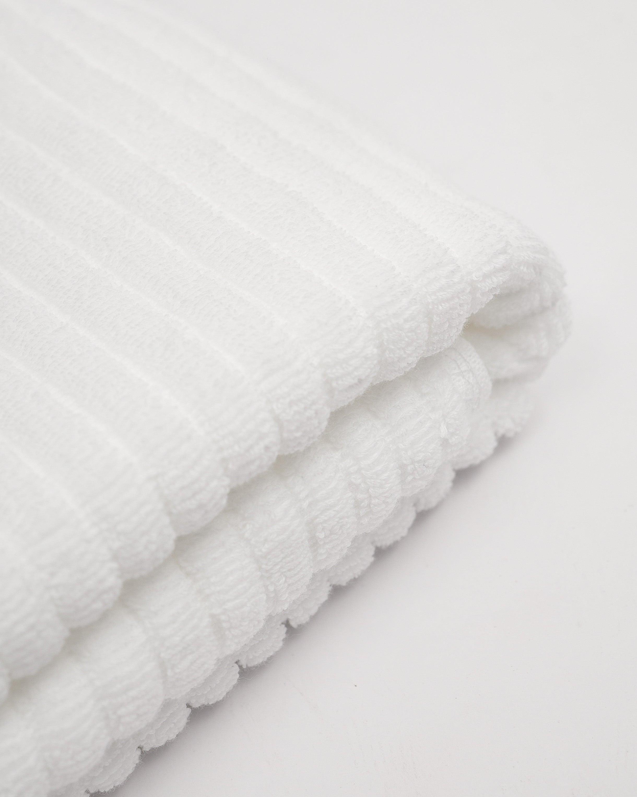 Linea Towel Collection in white, showcasing soft, plush cotton material for a luxurious bath experience.
