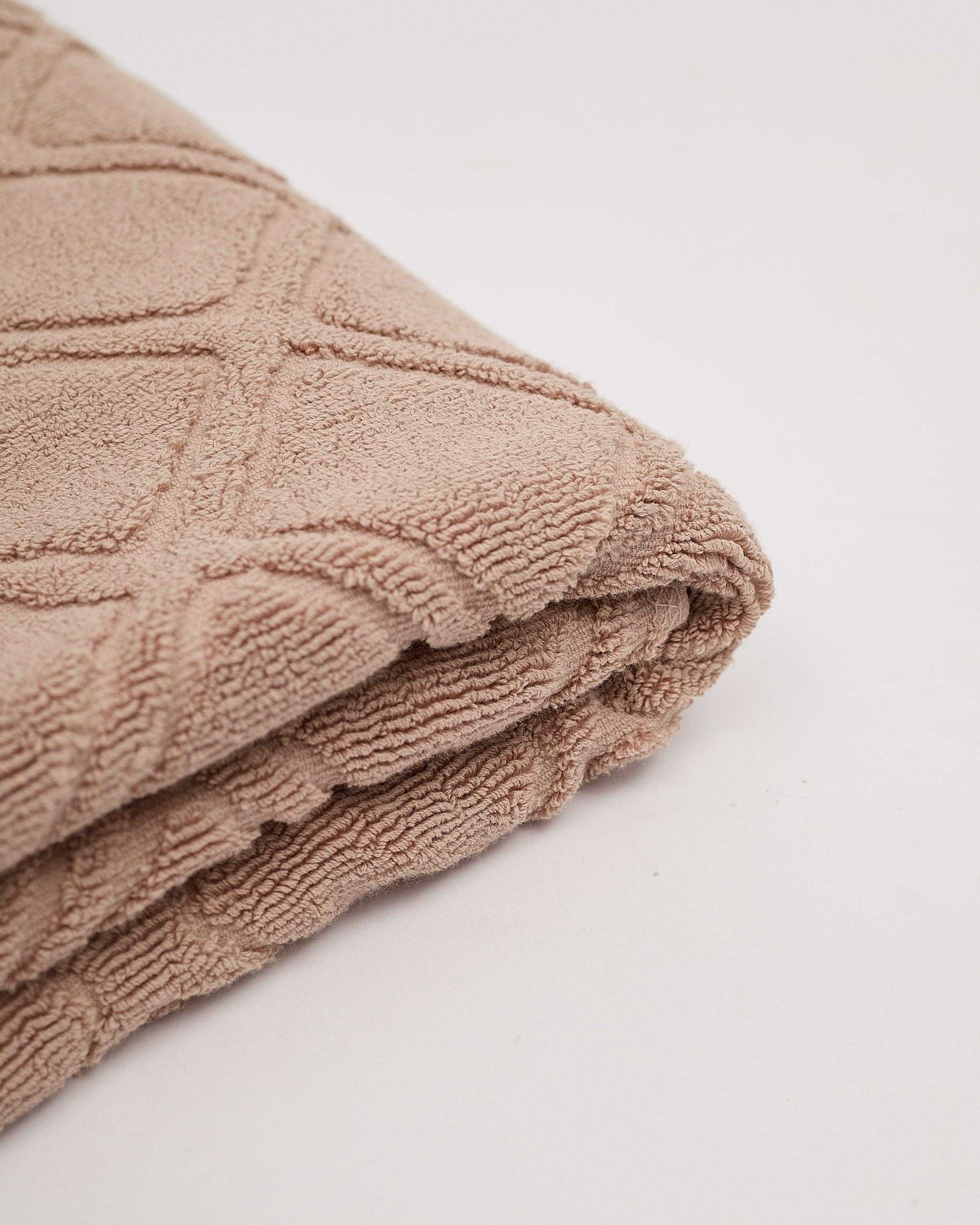 Soft and plush Gris Towel Collection, highly absorbent and perfect for modern bathrooms.
