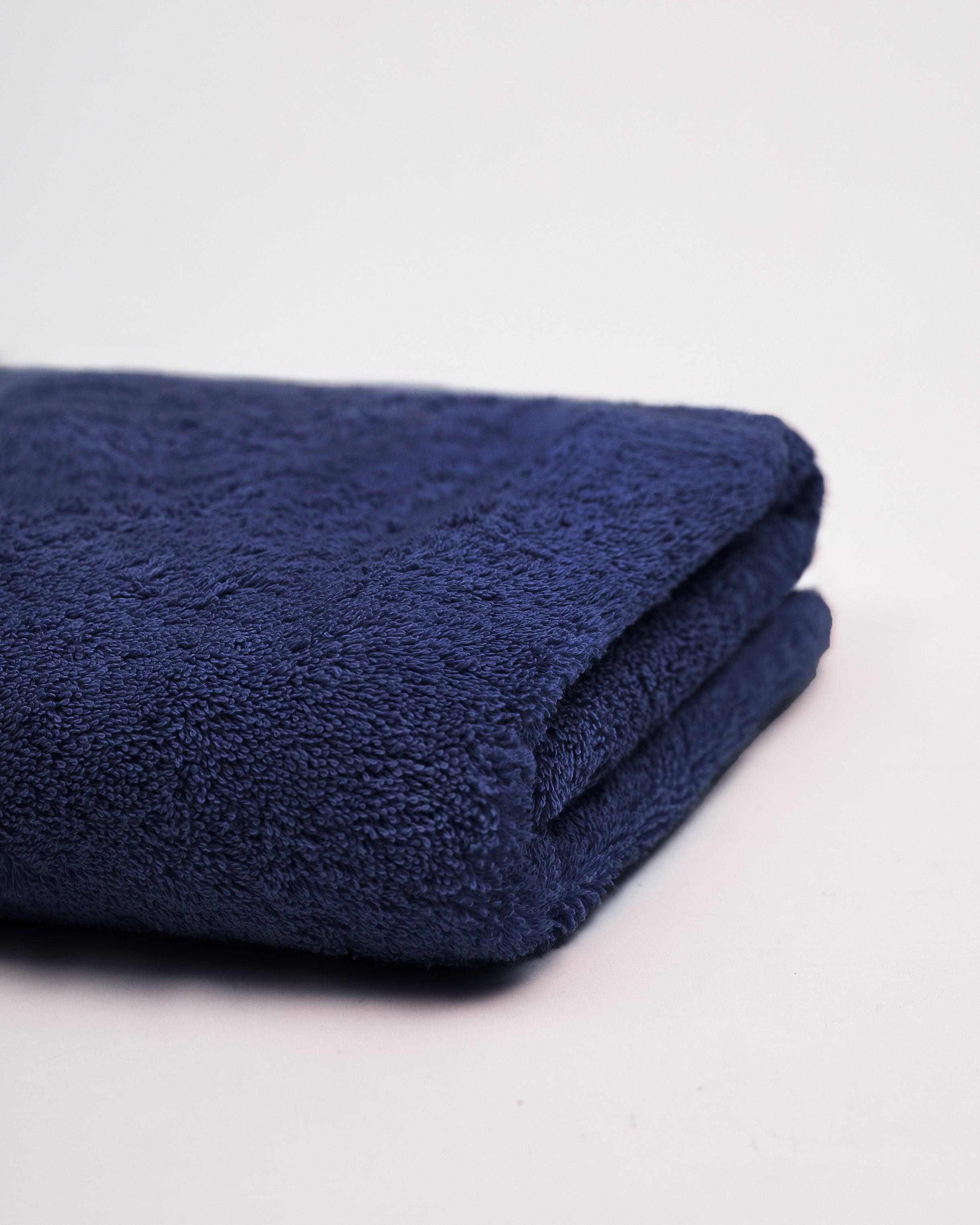 Deluxe Bath Sheet in navy blue, 100% cotton, folded.