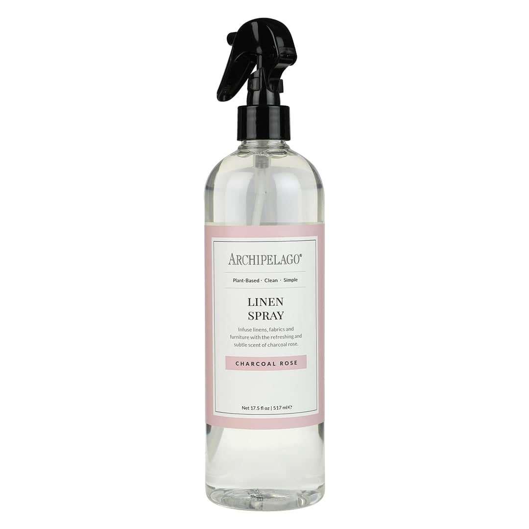 Archipelago Charcoal Rose Linen Spray bottle with black nozzle, infuses fabrics with charcoal rose and cedar scent.