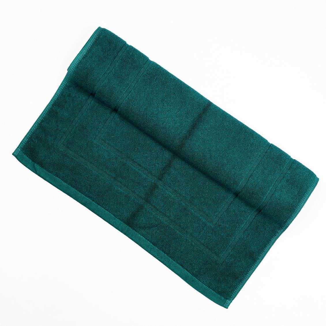 Plush green deluxe bath mat with absorbent design and spa-like comfort.