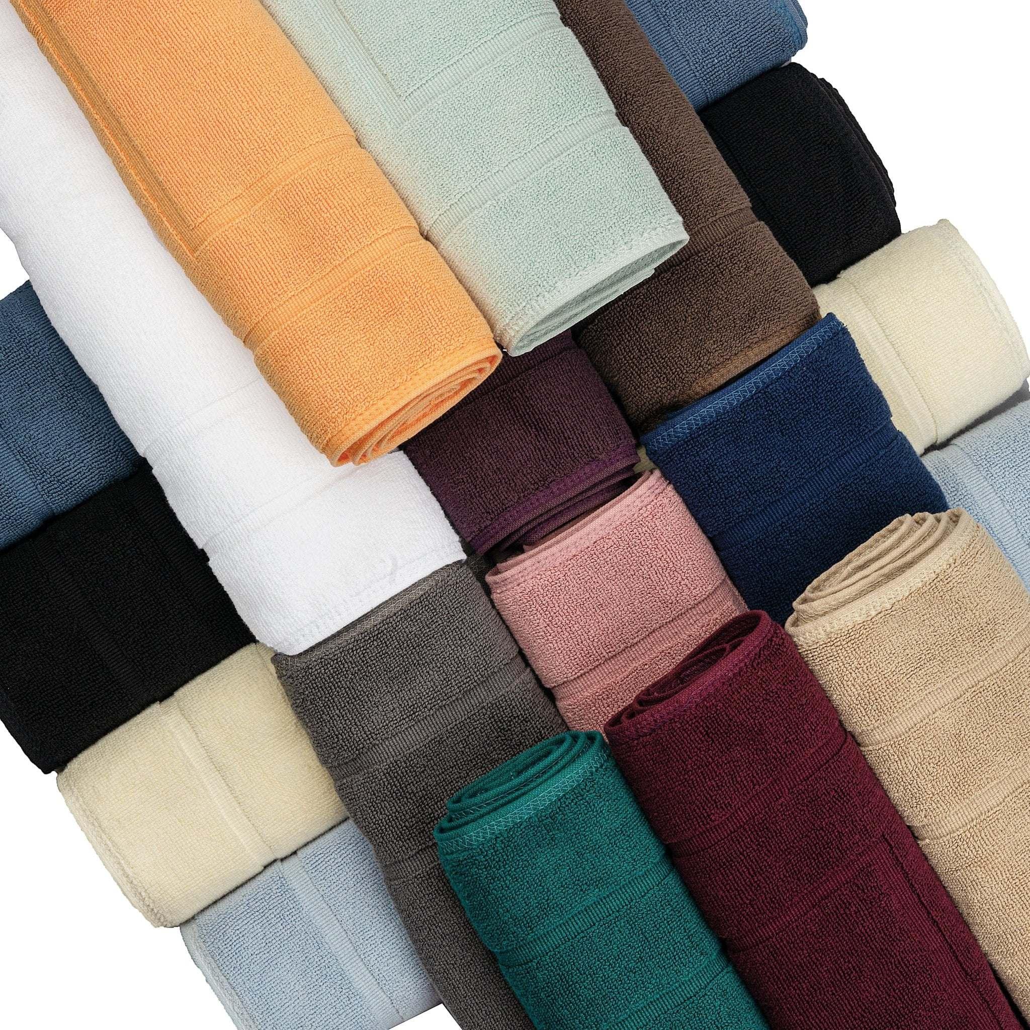 Assorted deluxe bath mats in 15 colors, plush and absorbent design.
