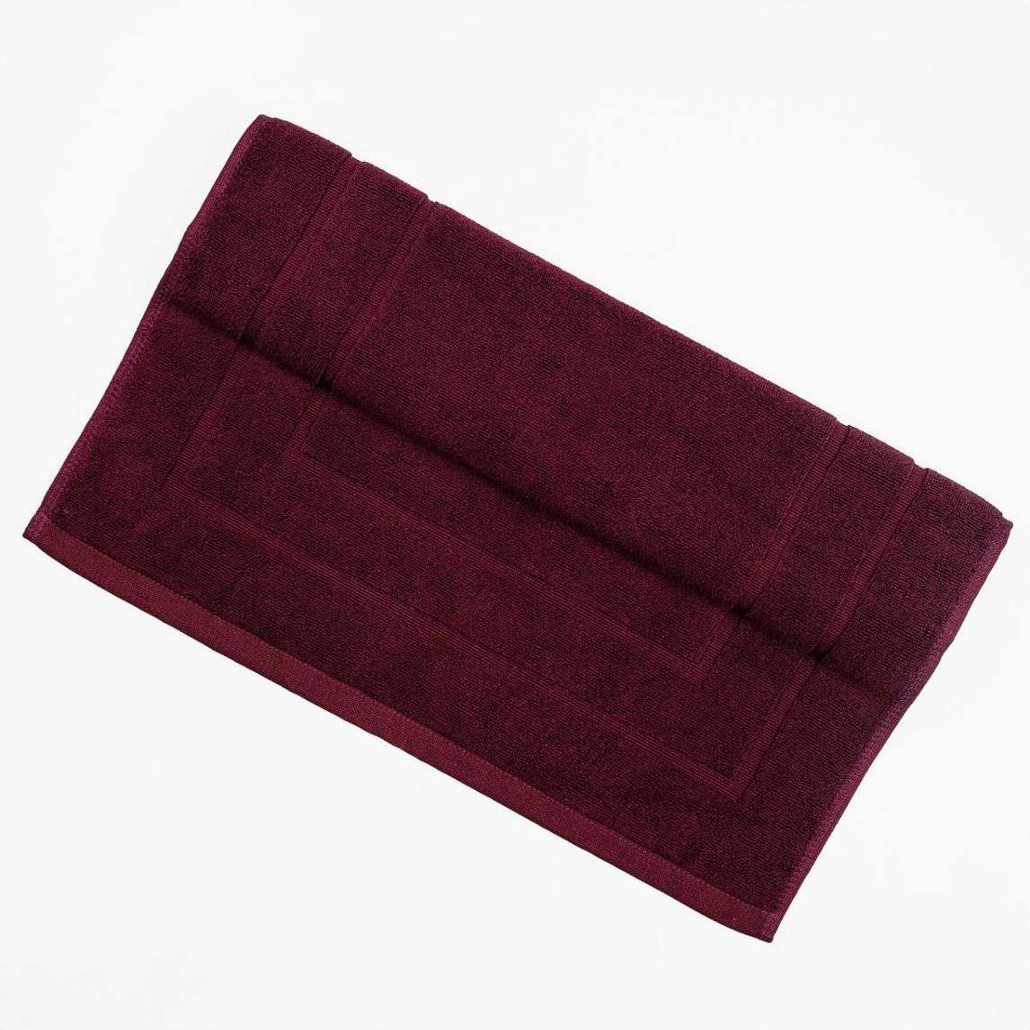 Plush burgundy deluxe bath mat with absorbent texture.