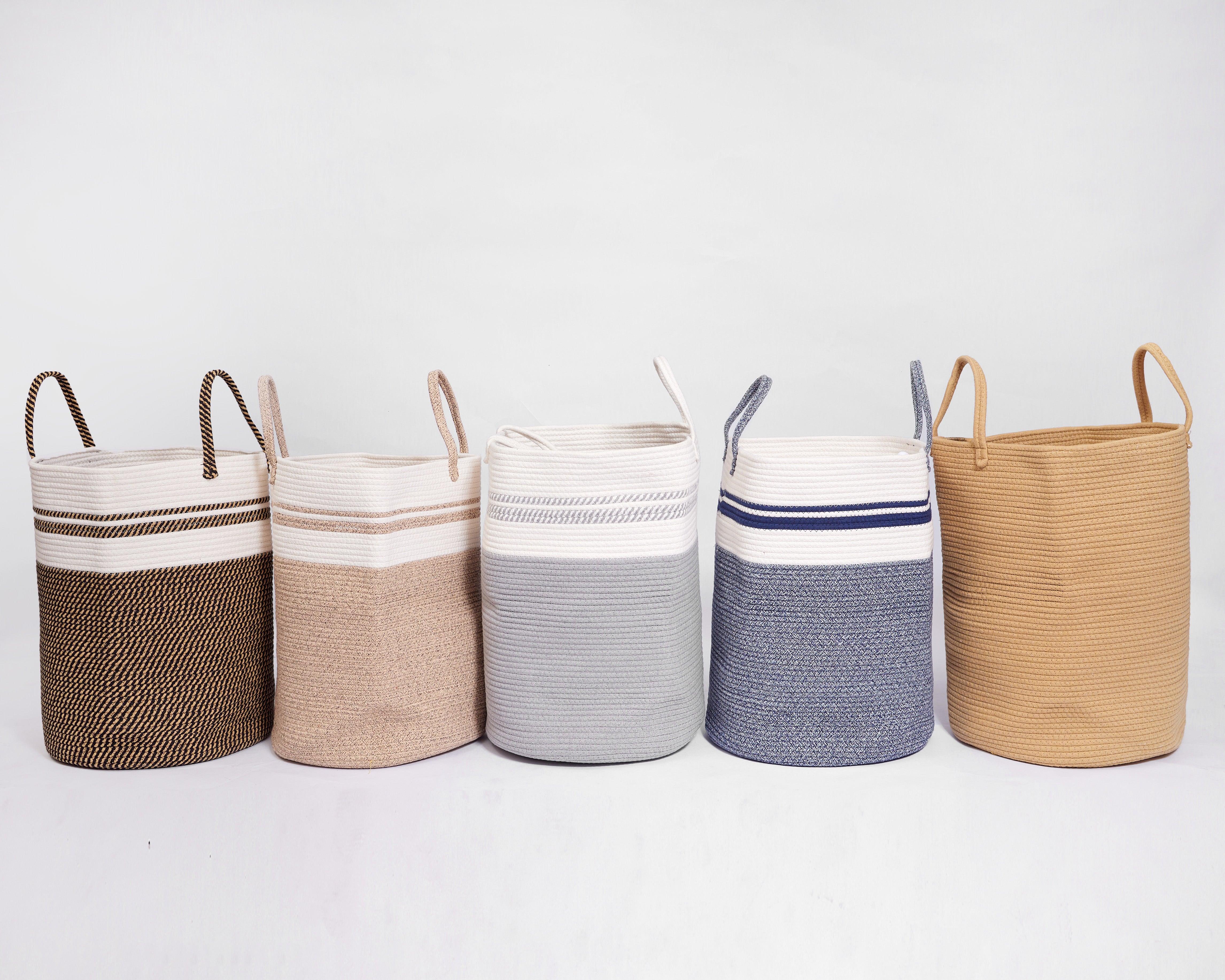 Set of five Oma Basket woven cotton rope storage baskets in various neutral colors with handles for practical and stylish organization