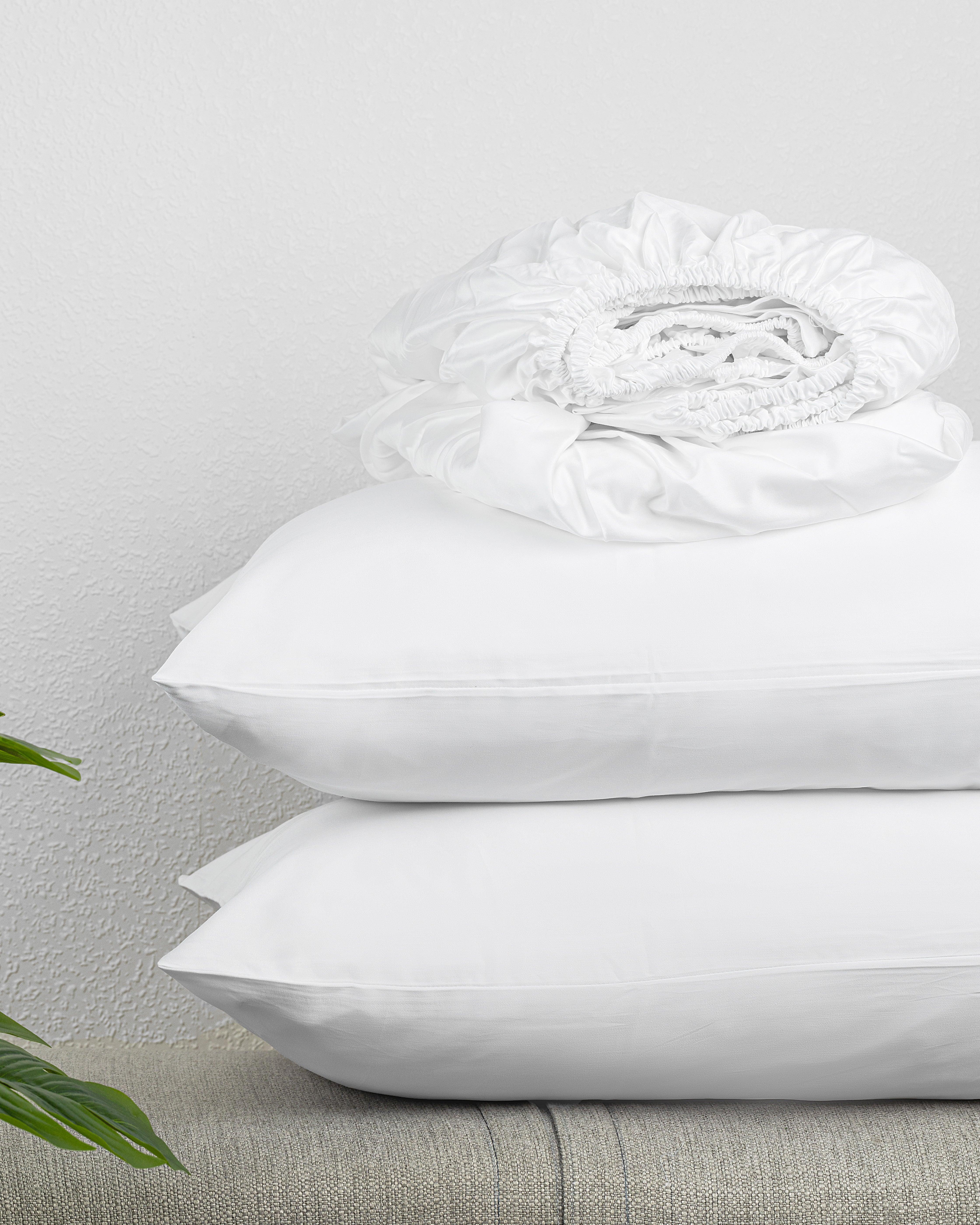 Luxe Kids Fitted Sheet Set in white with soft fabric, includes fitted sheet and pillowcases.