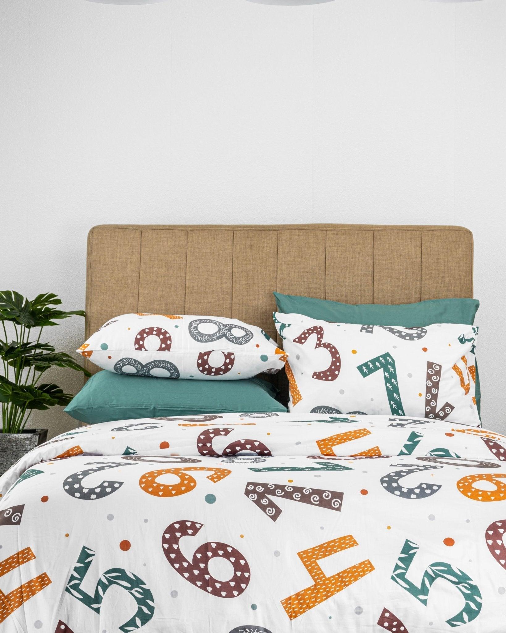 Numero Kids Duvet Cover Set featuring colorful number patterns on white bedding with matching pillowcases for educational children's bedroom decor